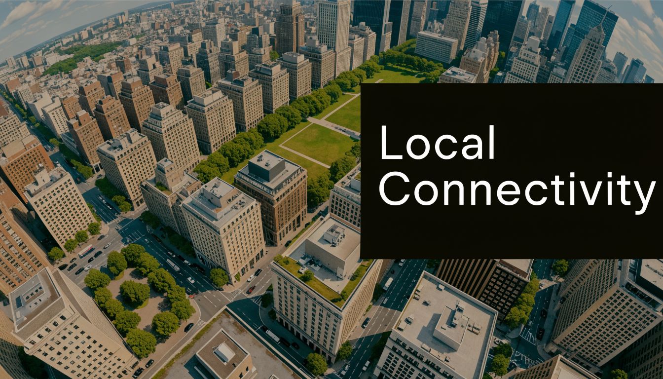 An aerial view of an urban cityscape with skyscrapers, streets, and a green park area.